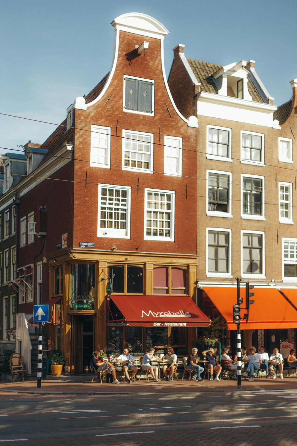 Classic Amsterdam corner café with a full terrace in the evening sun on the Vijzelgracht